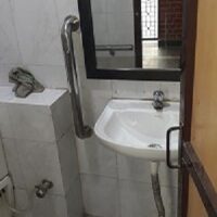 Accessible toilets with side rails Accessible toilets with side rails